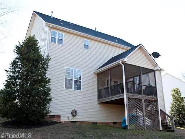 7839 Wilson Farm Road Summerfield, NC 27358 - Photo 15 of 16 Exterior Back. tall walk in crawl space, great for storage.