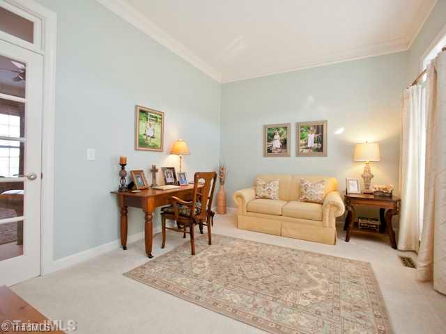 7839 Wilson Farm Road Summerfield, NC 27358 - Photo 3 of 16 Living Room. Living room which could work well as a home office, with French door connecting to the den area.