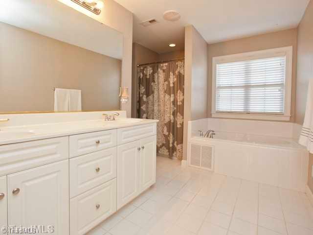 7839 Wilson Farm Road Summerfield, NC 27358 - Photo 9 of 16 Master Bath/Spa. Double vanities sinks, spacious cabinets, jetted tub, separate shower, separate water closet and access to large walk in closet.