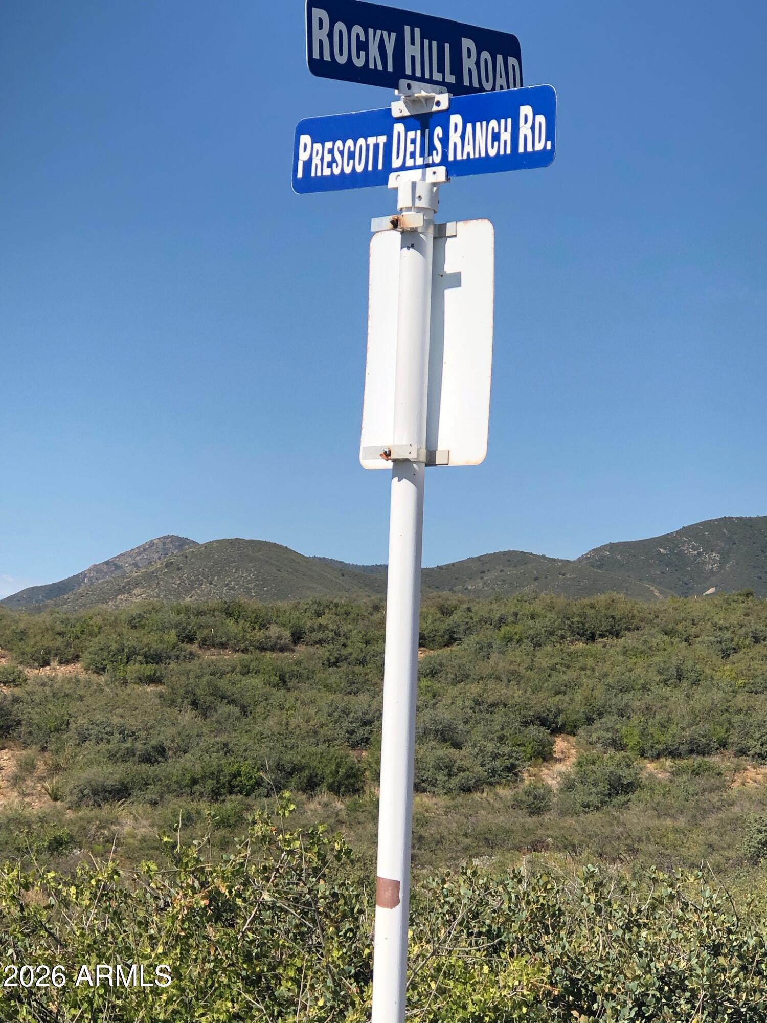 10424 East Prescott Dells Road, Unit 21 Dewey, AZ 86327 - Photo 3 of 6 a view of a street sign