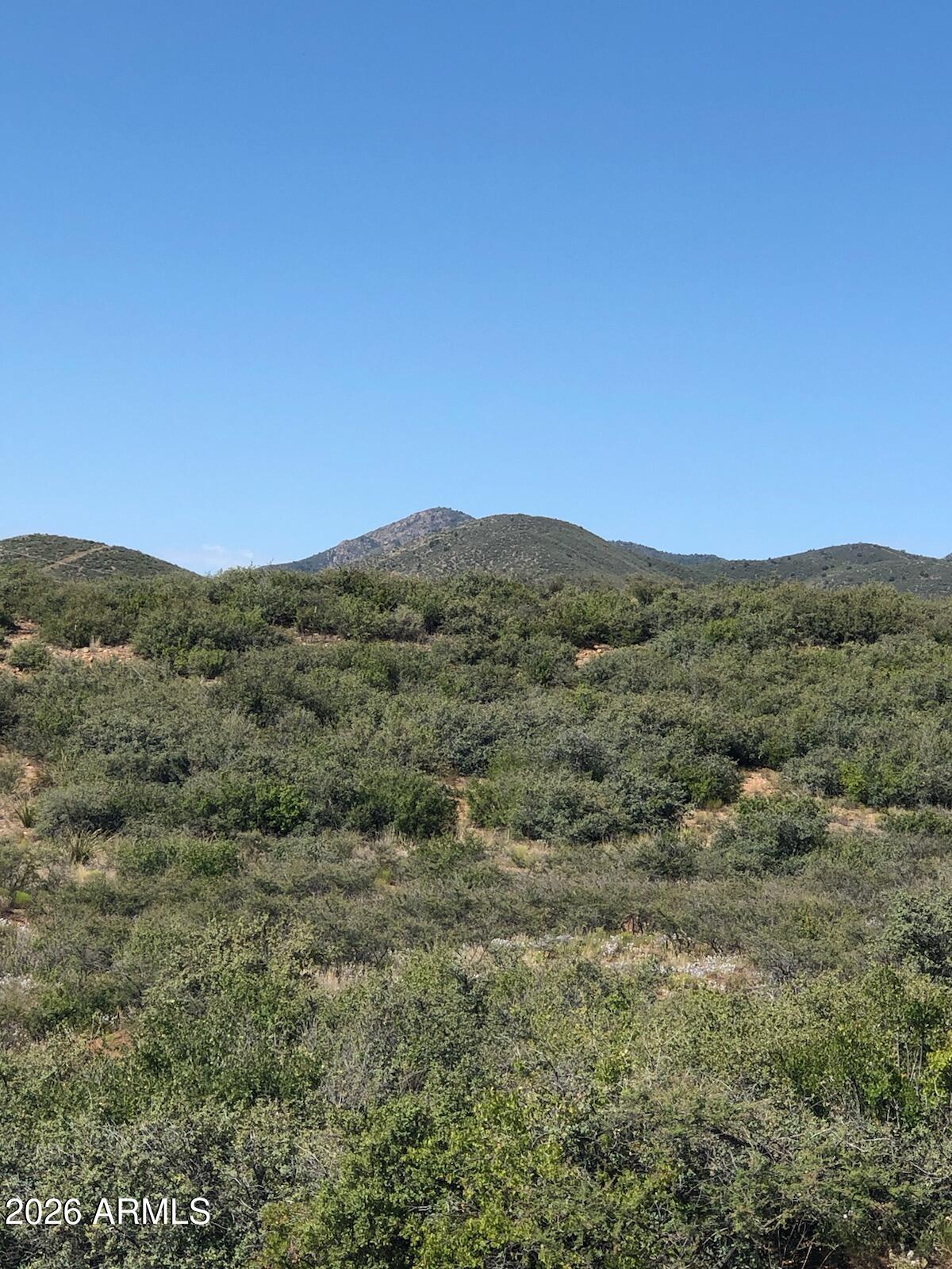 10424 East Prescott Dells Road, Unit 21 Dewey, AZ 86327 - Photo 4 of 6 a view of a large mountain with mountains in the background