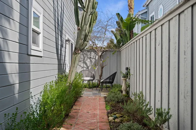 a couple of flower plants in front of door