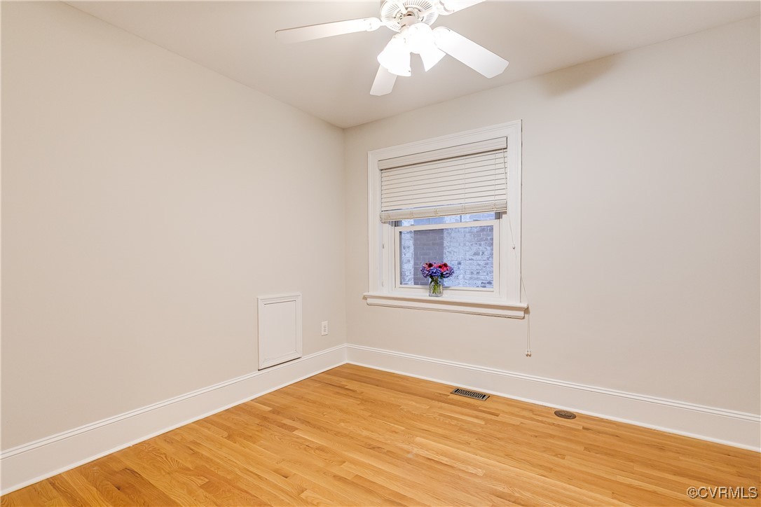 619 Roseneath Road, Unit U21 Richmond, VA 23221 - Photo 12 of 21 an empty room with wooden floor and fan