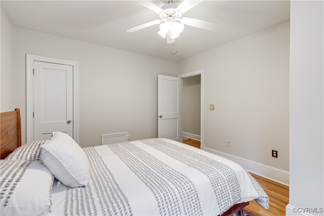 619 Roseneath Road, Unit U21 Richmond, VA 23221 - Photo 16 of 21 a bedroom with a bed and a chandelier
