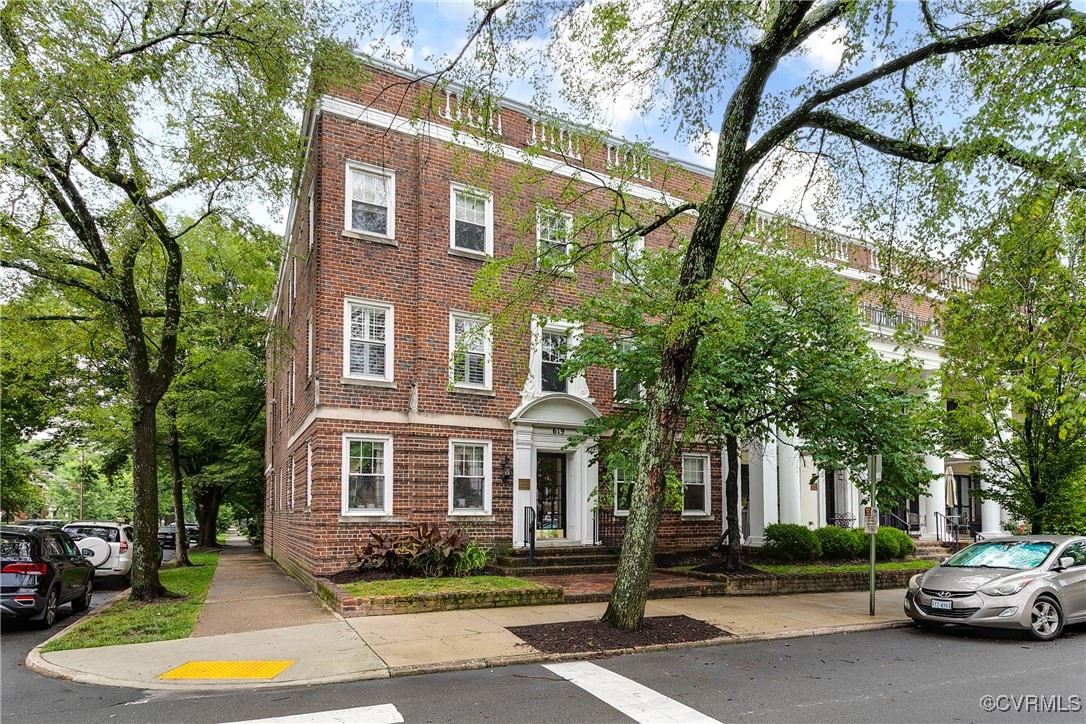 619 Roseneath Road, Unit U21 Richmond, VA 23221 - Photo 2 of 21 a front view of a building with trees