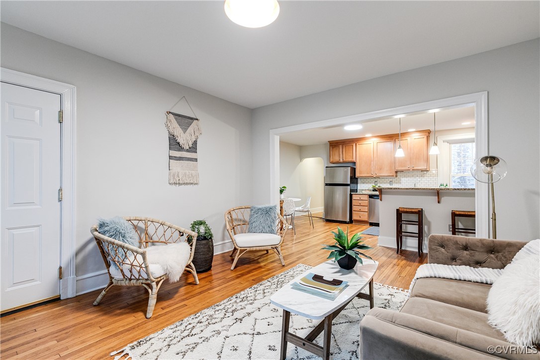619 Roseneath Road, Unit U21 Richmond, VA 23221 - Photo 4 of 21 a living room with furniture fireplace and a large window