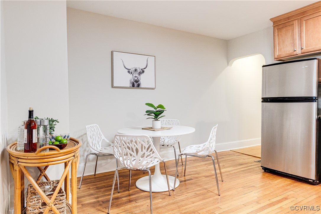 619 Roseneath Road, Unit U21 Richmond, VA 23221 - Photo 9 of 21 a view of a dining room with furniture and wooden floor