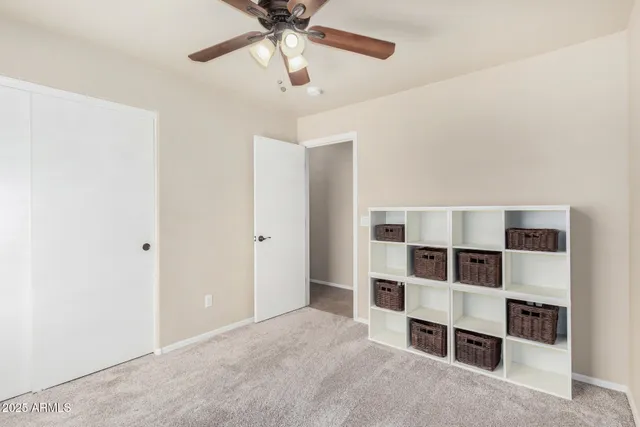 a view of an empty room with a cabinet