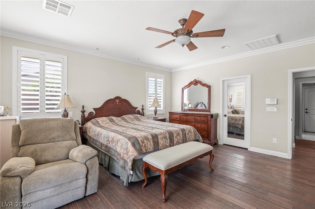 8431 Durango Ranch Court Las Vegas, NV 89113 - Photo 28 of 49 This spacious bedroom features elegant wood flooring and bright natural light.