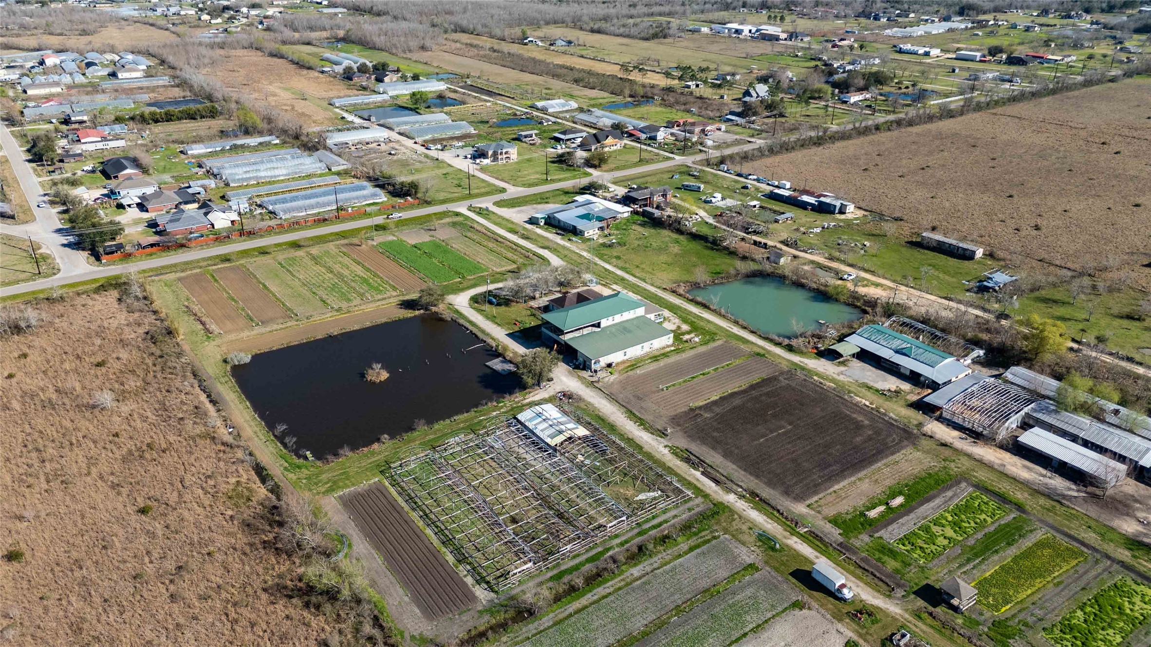 7954 County Road 121 Rosharon, TX 77583 - Photo 28 of 35 an aerial view of residential houses with outdoor space