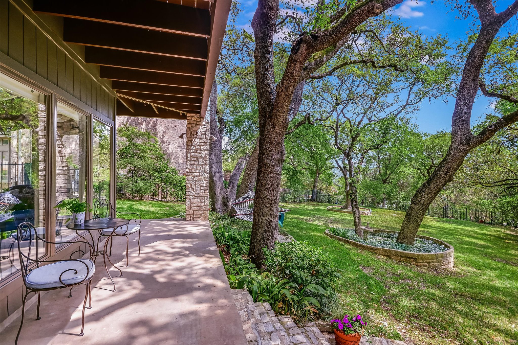 3901 Prentice Lane Austin, TX 78746 - Photo 22 of 40 The backyard provides a quiet retreat where nature and outdoor living come together beautifully.