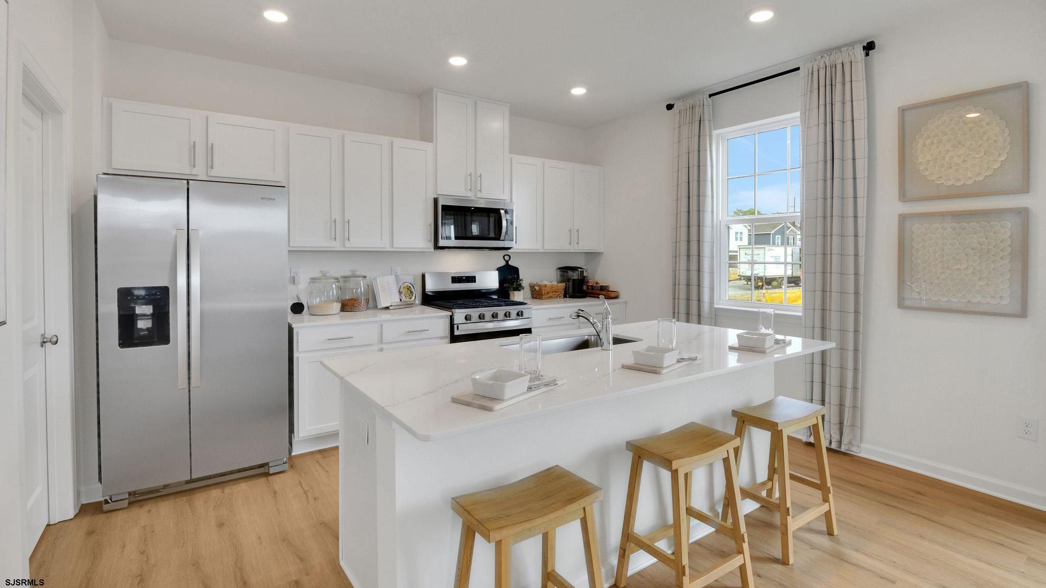 223 Daytona Road Egg Harbor Township, NJ 08234 - Photo 17 of 31 a kitchen with stainless steel appliances granite countertop a refrigerator and a stove top oven
