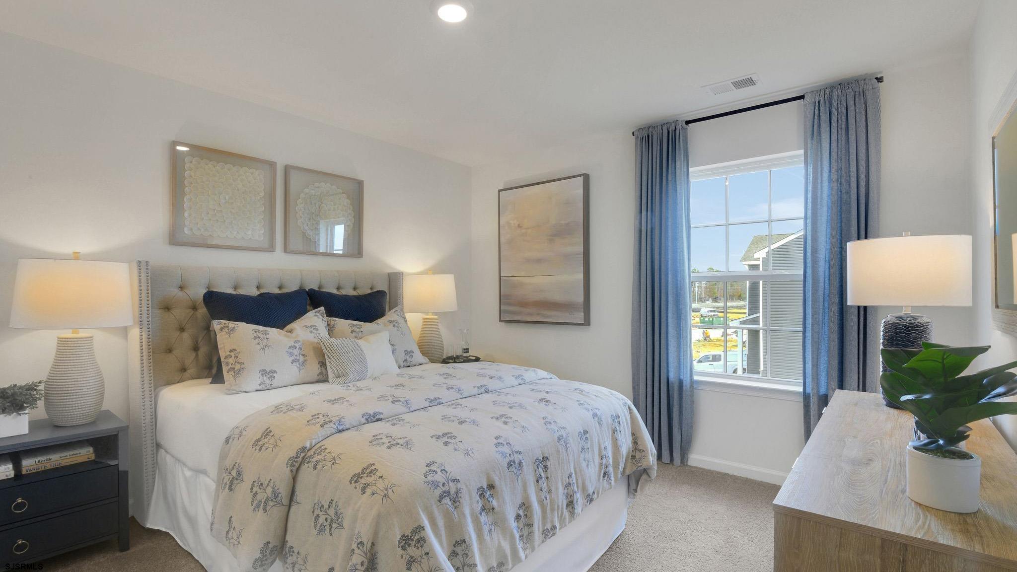 223 Daytona Road Egg Harbor Township, NJ 08234 - Photo 26 of 31 a bedroom with a large bed and a window