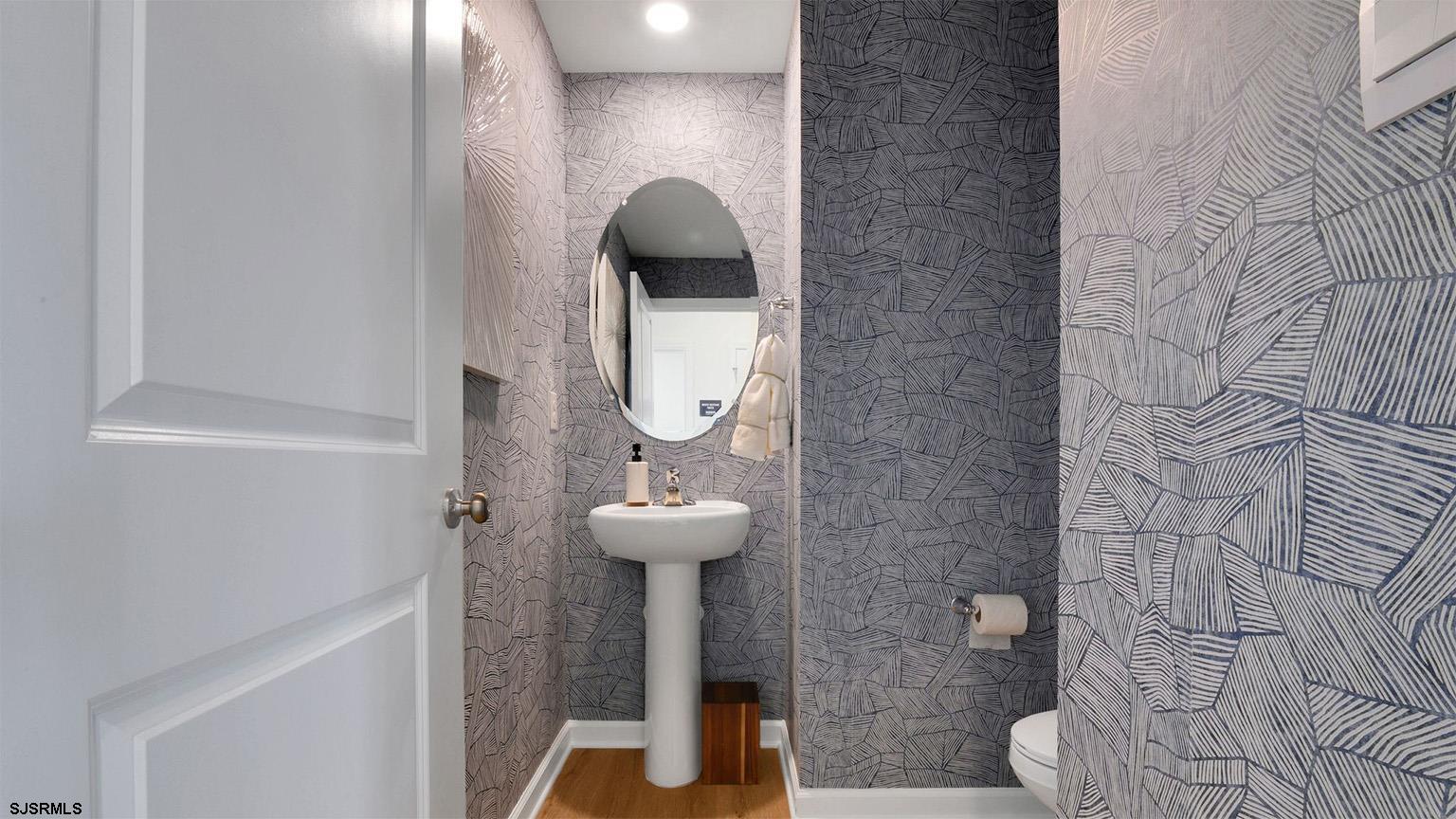 223 Daytona Road Egg Harbor Township, NJ 08234 - Photo 27 of 31 a bathroom with a sink and mirror