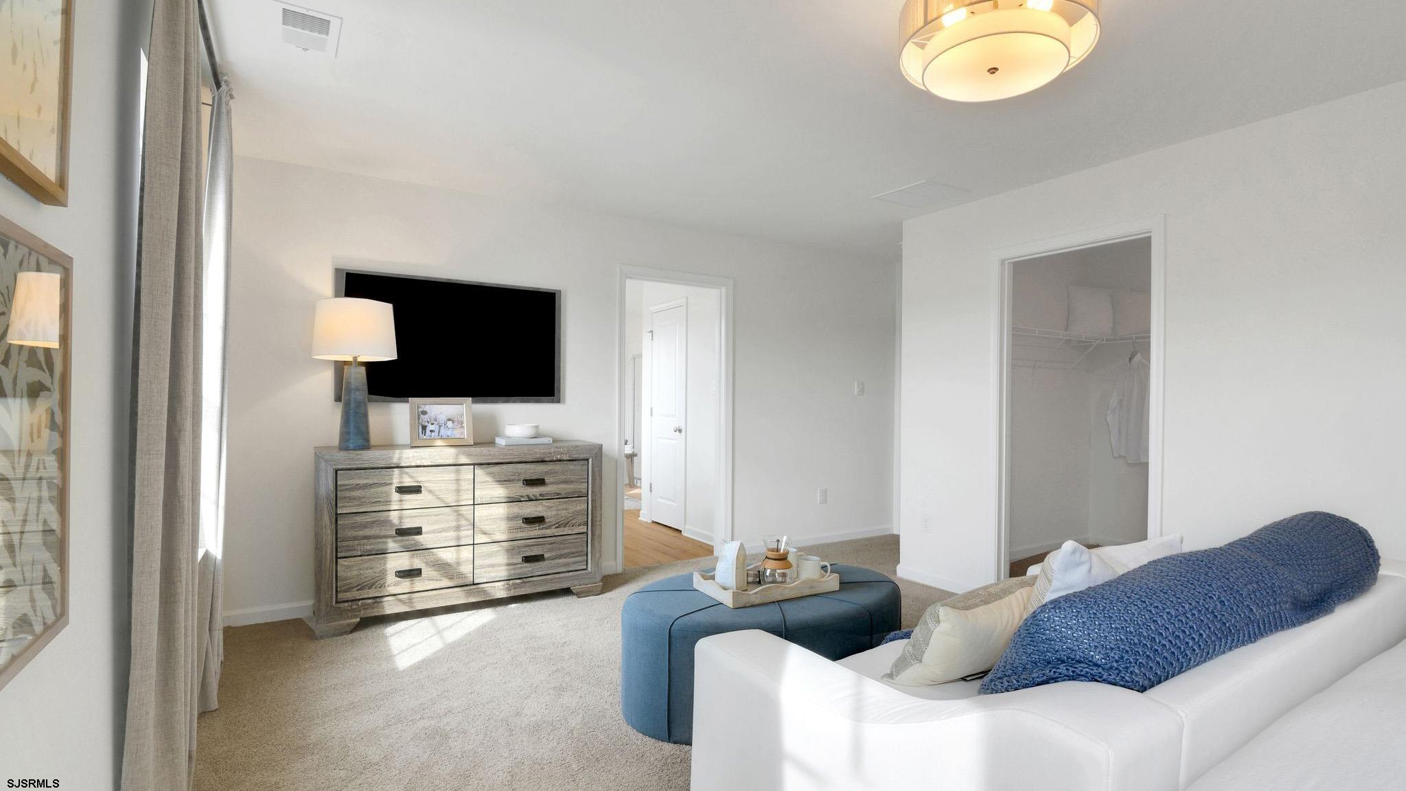 223 Daytona Road Egg Harbor Township, NJ 08234 - Photo 7 of 31 a living room with furniture and a flat screen tv