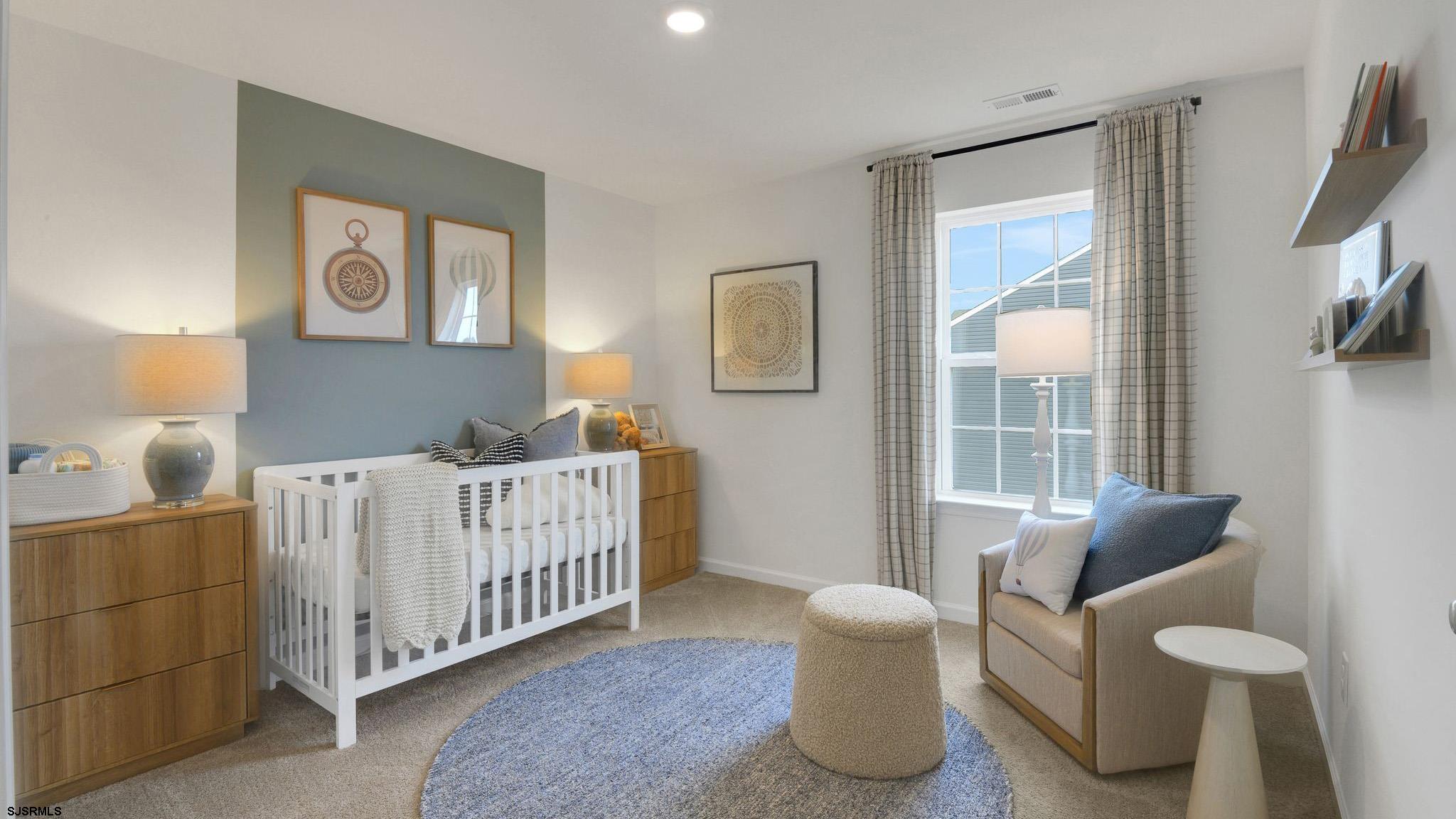 223 Daytona Road Egg Harbor Township, NJ 08234 - Photo 9 of 31 a bedroom with furniture and a large window