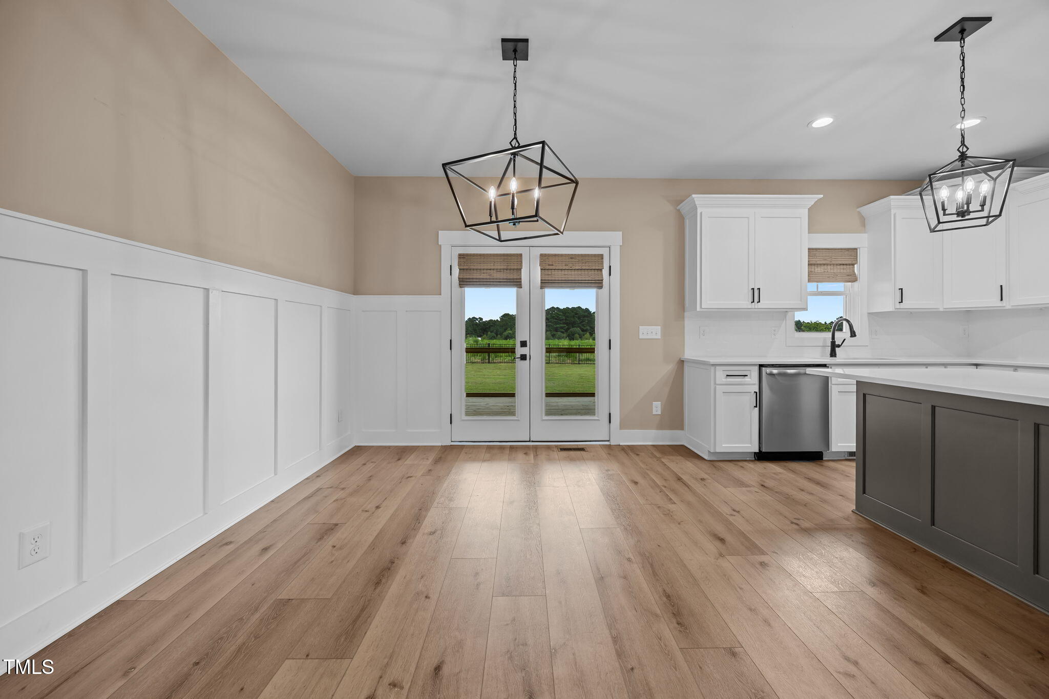 1270 Sheriff Johnson Road Angier, NC 27501 - Photo 9 of 50 a view of a kitchen with microwave and wooden floor
