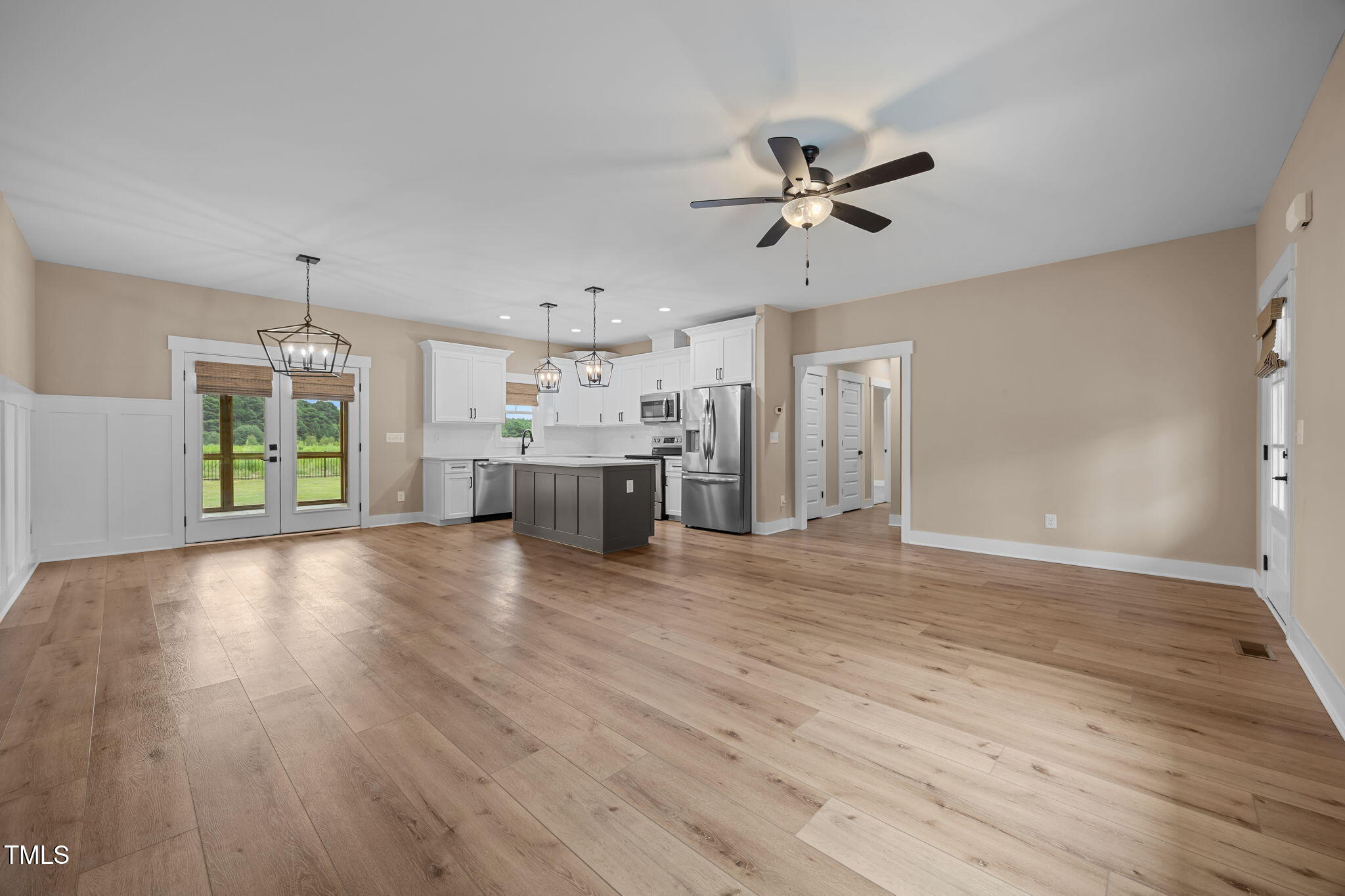 1270 Sheriff Johnson Road Angier, NC 27501 - Photo 11 of 50 a view of a livingroom with a hardwood floor and a ceiling fan