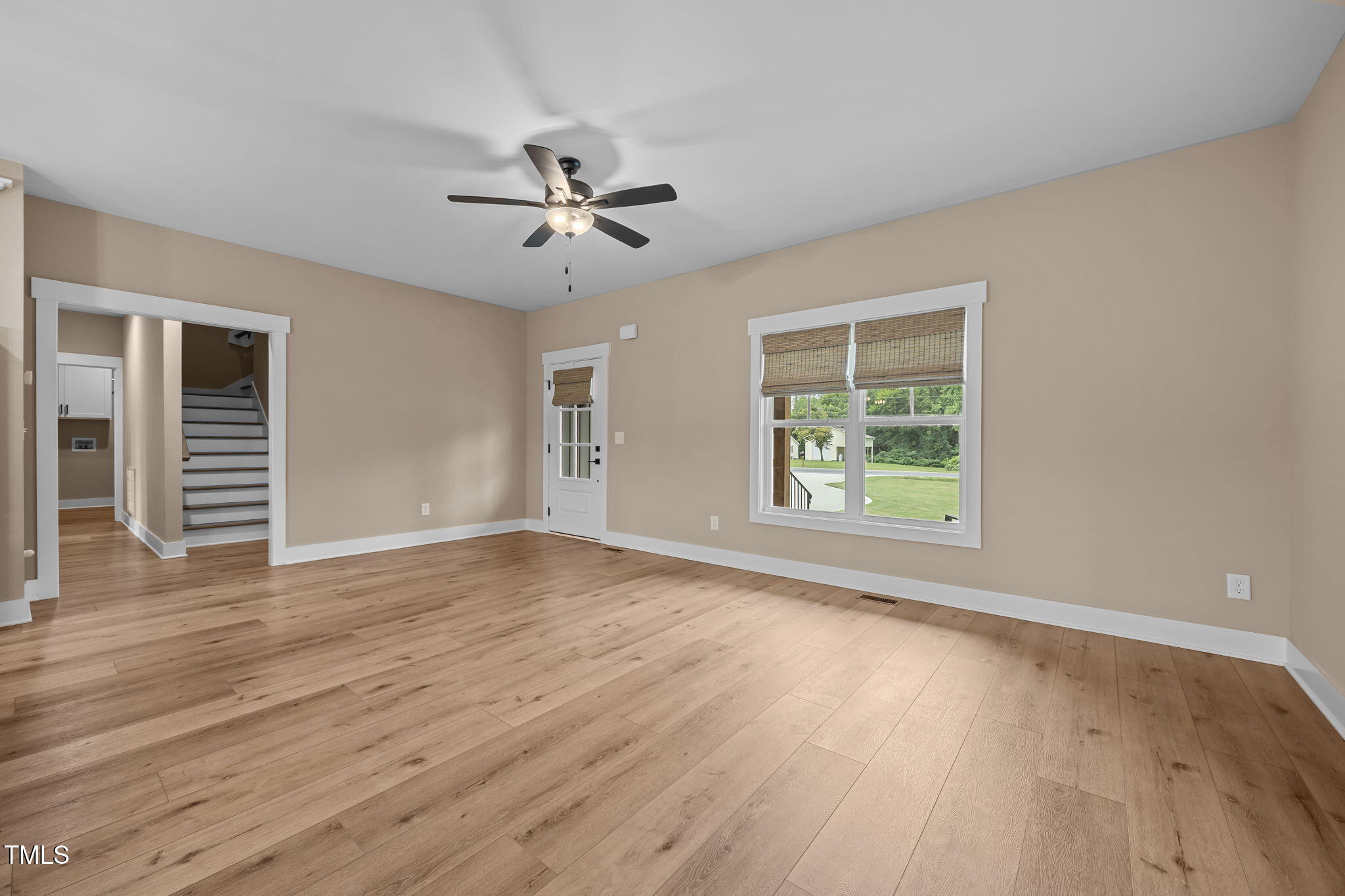1270 Sheriff Johnson Road Angier, NC 27501 - Photo 13 of 50 a view of empty room with wooden floor and fan