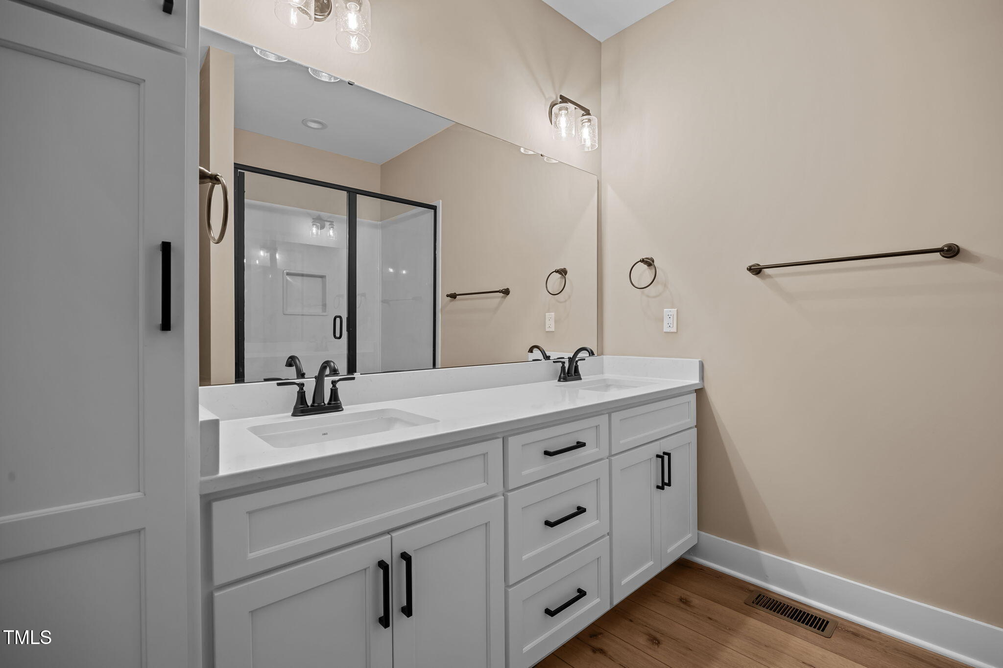 1270 Sheriff Johnson Road Angier, NC 27501 - Photo 14 of 50 a bathroom with a double vanity sink and mirror