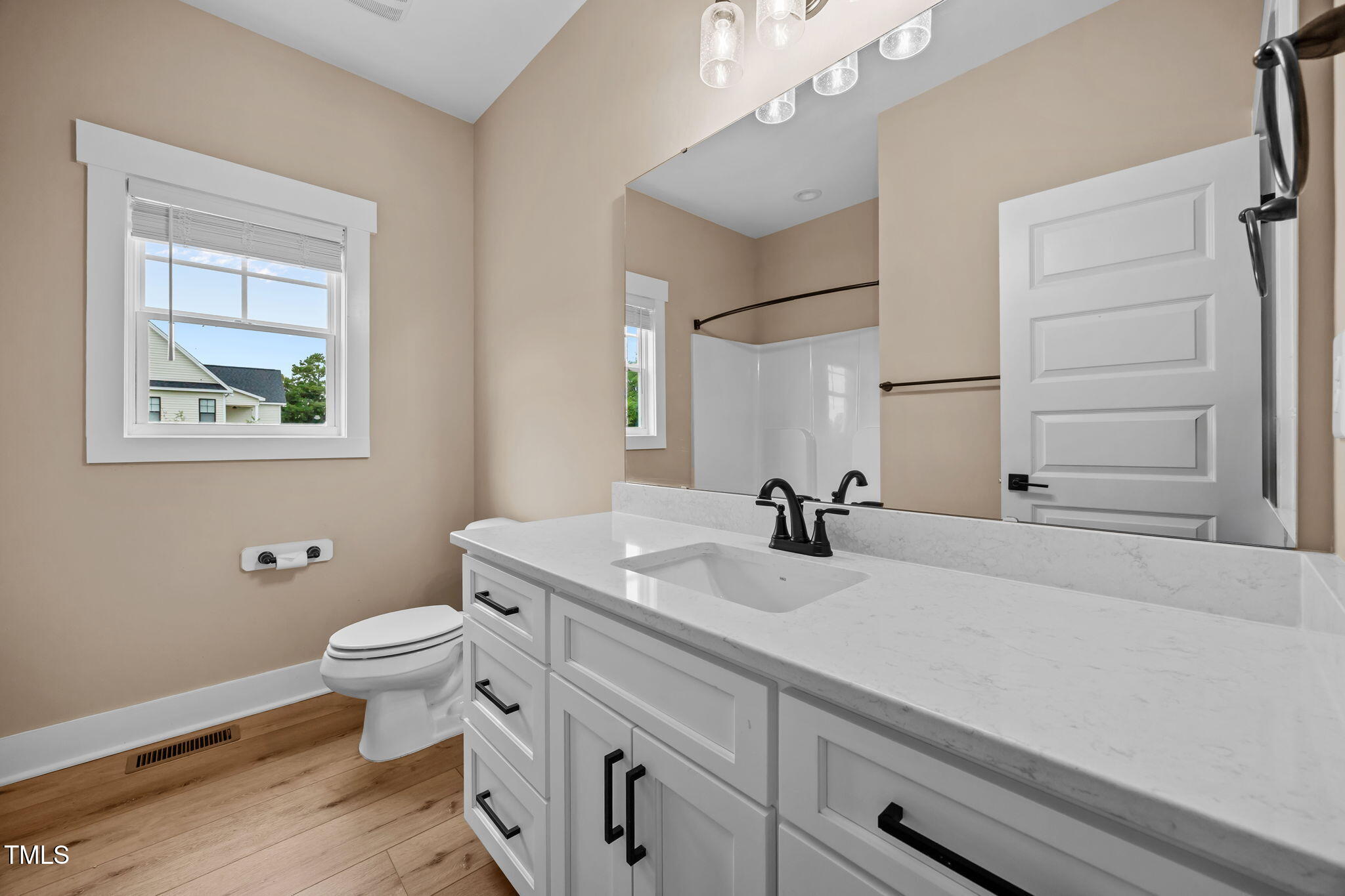 1270 Sheriff Johnson Road Angier, NC 27501 - Photo 17 of 50 a bathroom with a sink a toilet and a mirror