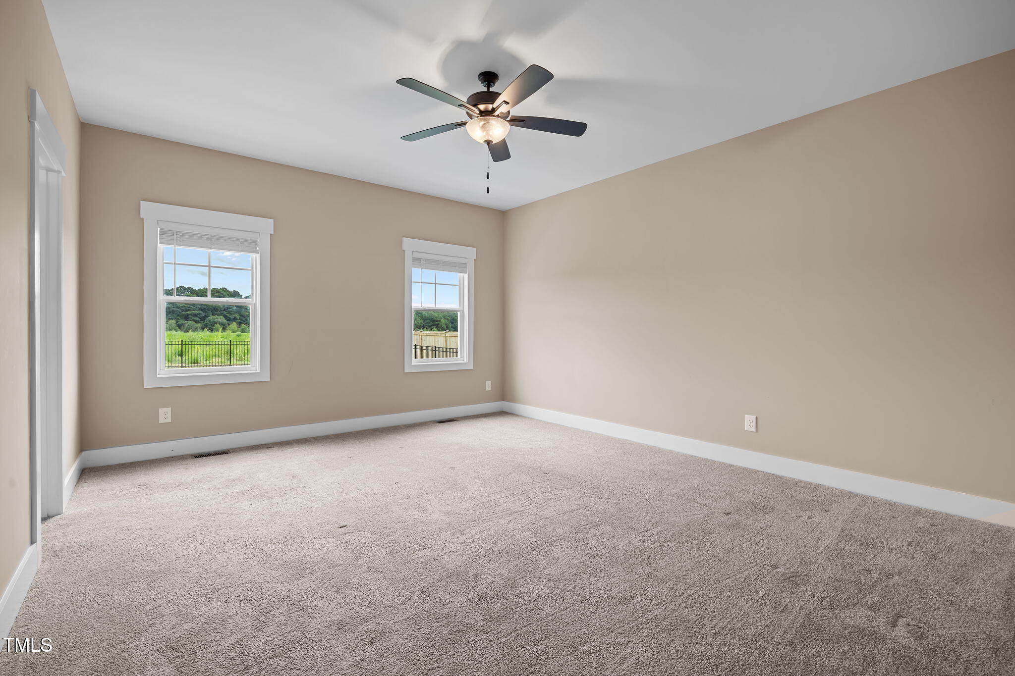 1270 Sheriff Johnson Road Angier, NC 27501 - Photo 21 of 50 an empty room with a ceiling fan and window