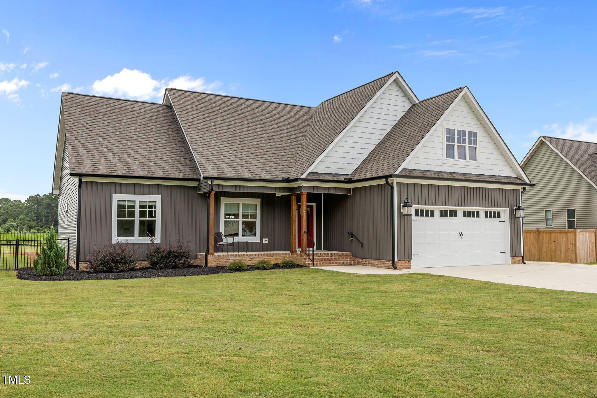 1270 Sheriff Johnson Road Angier, NC 27501 - Photo 31 of 50 a front view of a house with garden