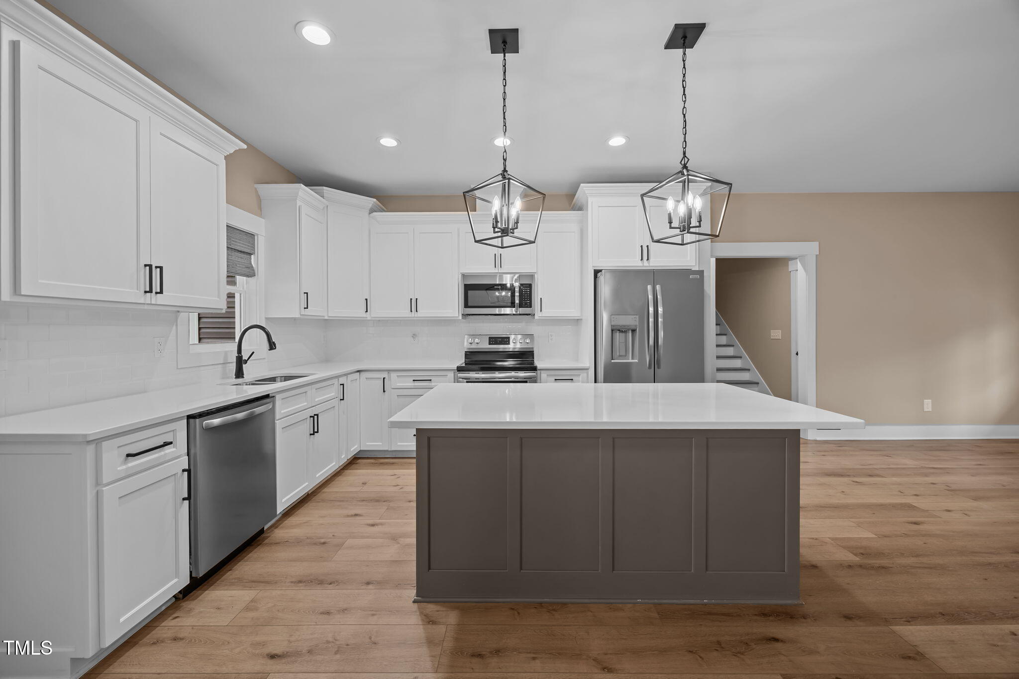 1270 Sheriff Johnson Road Angier, NC 27501 - Photo 4 of 50 a kitchen with kitchen island granite countertop a sink a counter space appliances and cabinets