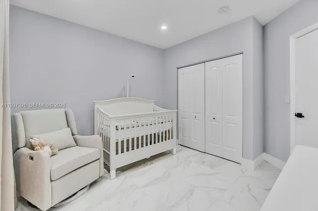 a bedroom with furniture and a ceiling fan