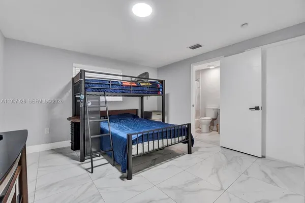 a bedroom with a bed and a closet