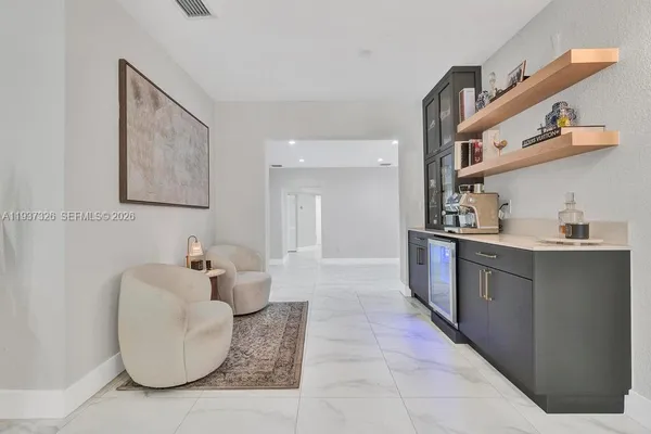 a kitchen with cabinets and window