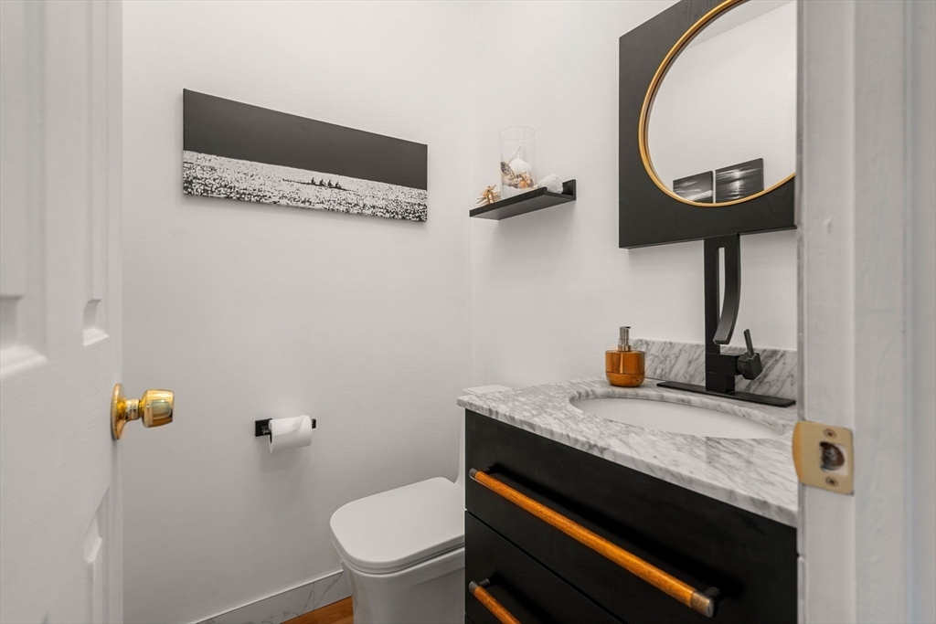 49 Parker Road Shirley, MA 01464 - Photo 17 of 42 a bathroom with a granite countertop toilet and a sink