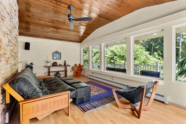 a view of living room with furniture and wooden deck