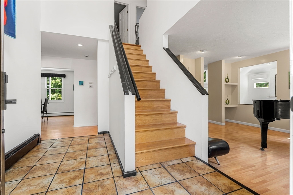 49 Parker Road Shirley, MA 01464 - Photo 25 of 42 a view of entryway with wooden floor and stairs