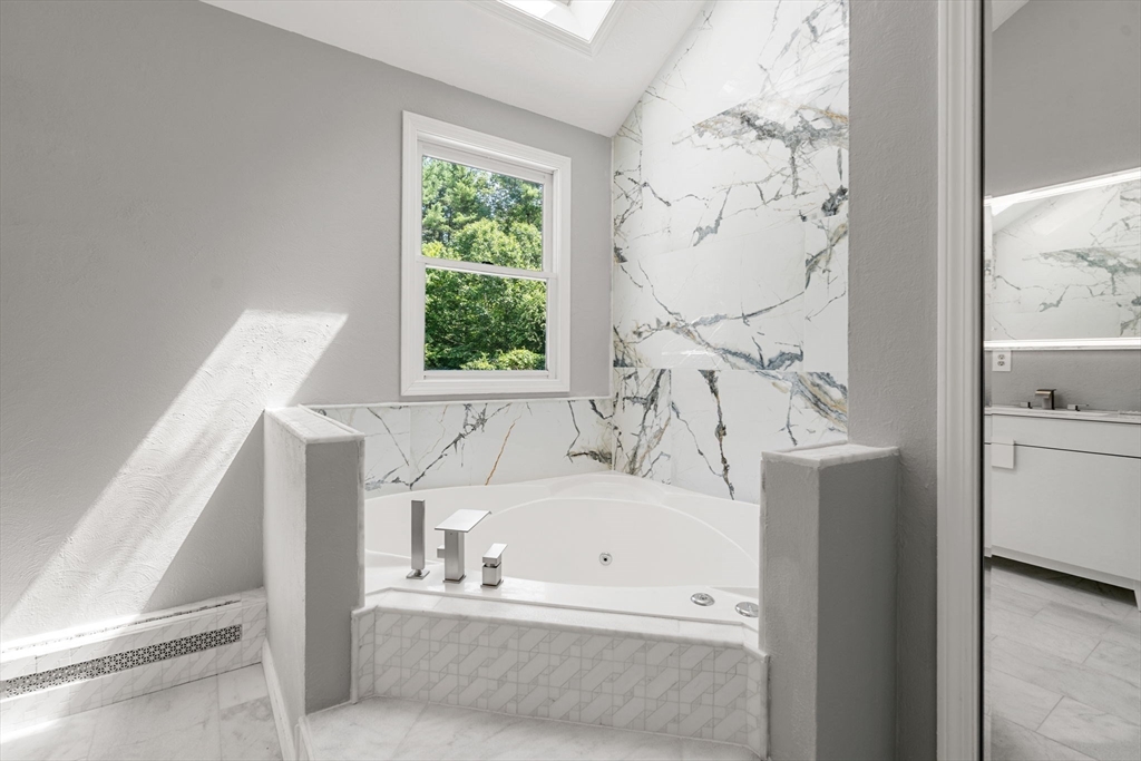 49 Parker Road Shirley, MA 01464 - Photo 30 of 42 a bathroom with a bathtub and a window
