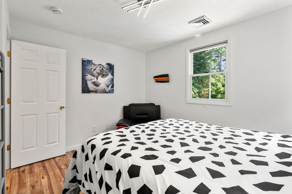 49 Parker Road Shirley, MA 01464 - Photo 35 of 42 a bedroom with a bed and a window