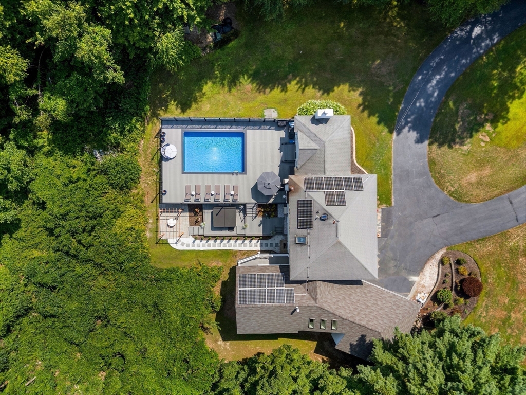 49 Parker Road Shirley, MA 01464 - Photo 40 of 42 an aerial view of a house with swimming pool and large trees