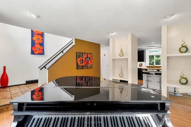 a view of living room with furniture and air hockey table