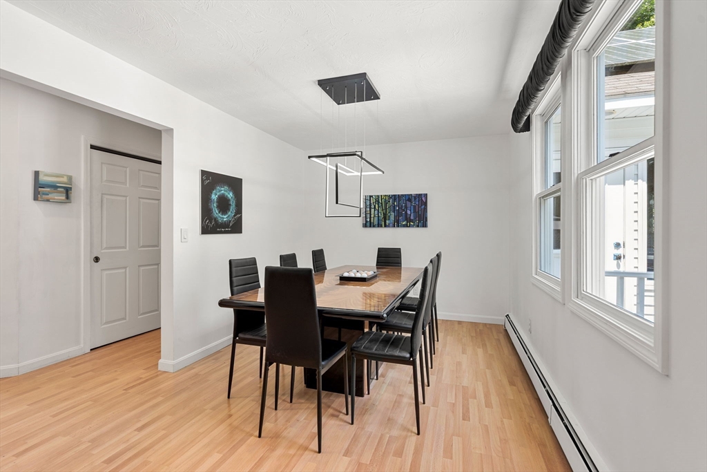 49 Parker Road Shirley, MA 01464 - Photo 10 of 42 a view of a dining room with furniture and wooden floor