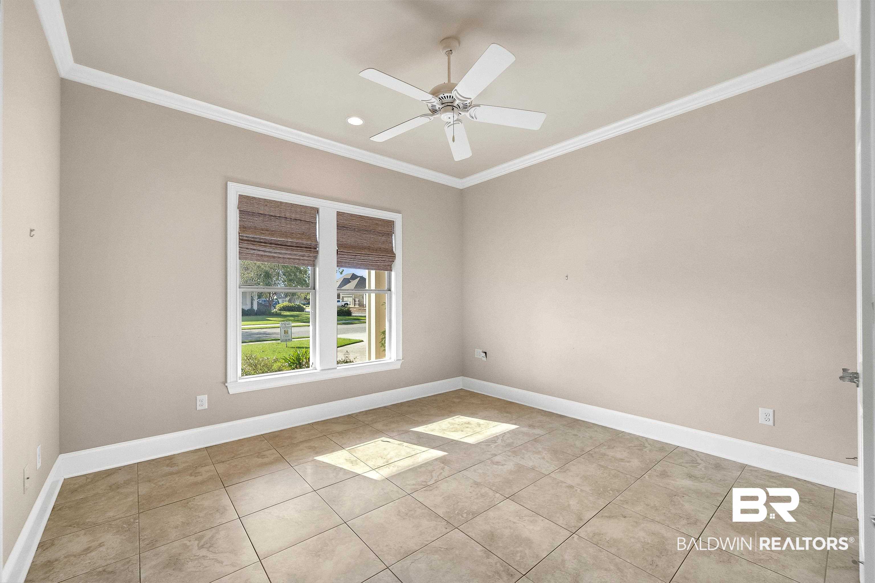 17663 Burwick Loop Fairhope, AL 36532 - Photo 23 of 41 Unfurnished room with light tile patterned floors, ornamental molding, and ceiling fan