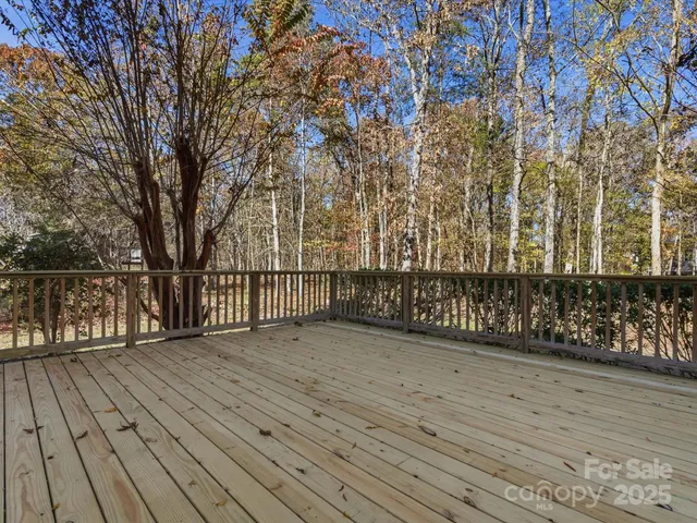 a view of deck with wooden floor and fence