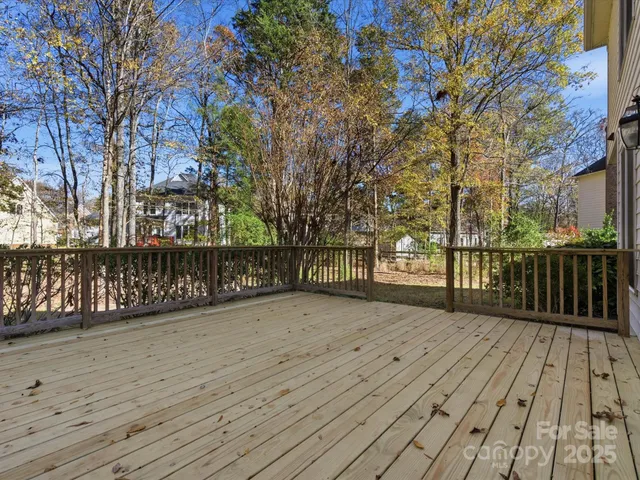 a view of wooden deck with a trees