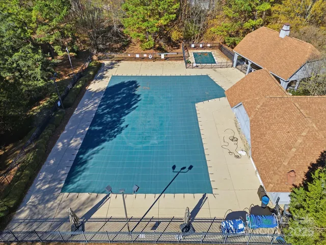 an aerial view of a house with outdoor space