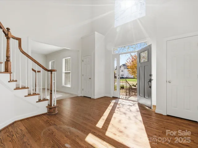 a view of entryway with wooden floor