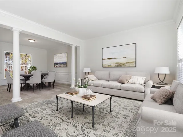 a living room with furniture a rug and a table