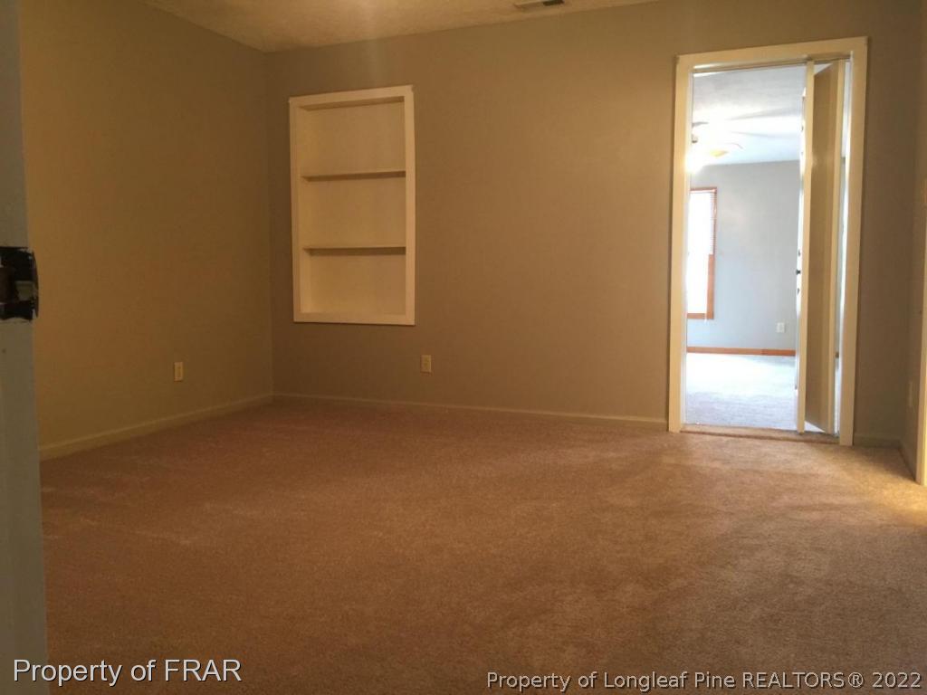 7685 Elliott Bridge Road Spring Lake, NC 28390 - Photo 16 of 26 an empty room with windows