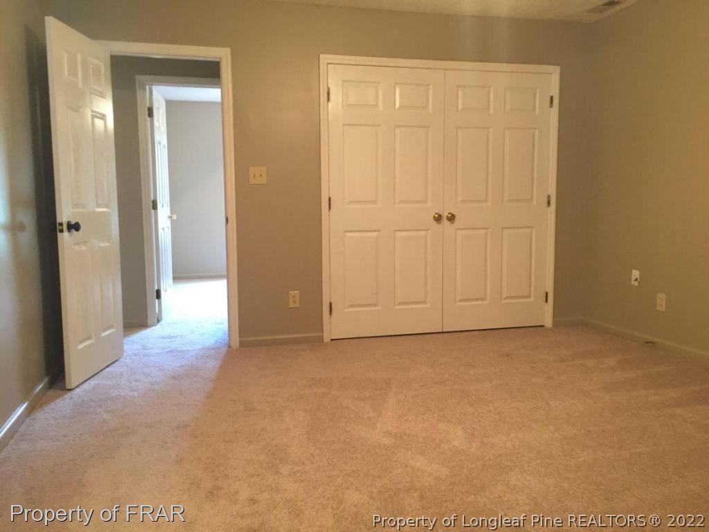 7685 Elliott Bridge Road Spring Lake, NC 28390 - Photo 17 of 26 an empty room with closet area