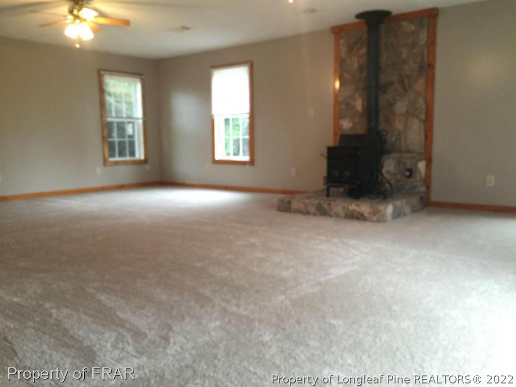 7685 Elliott Bridge Road Spring Lake, NC 28390 - Photo 24 of 26 an empty room with windows