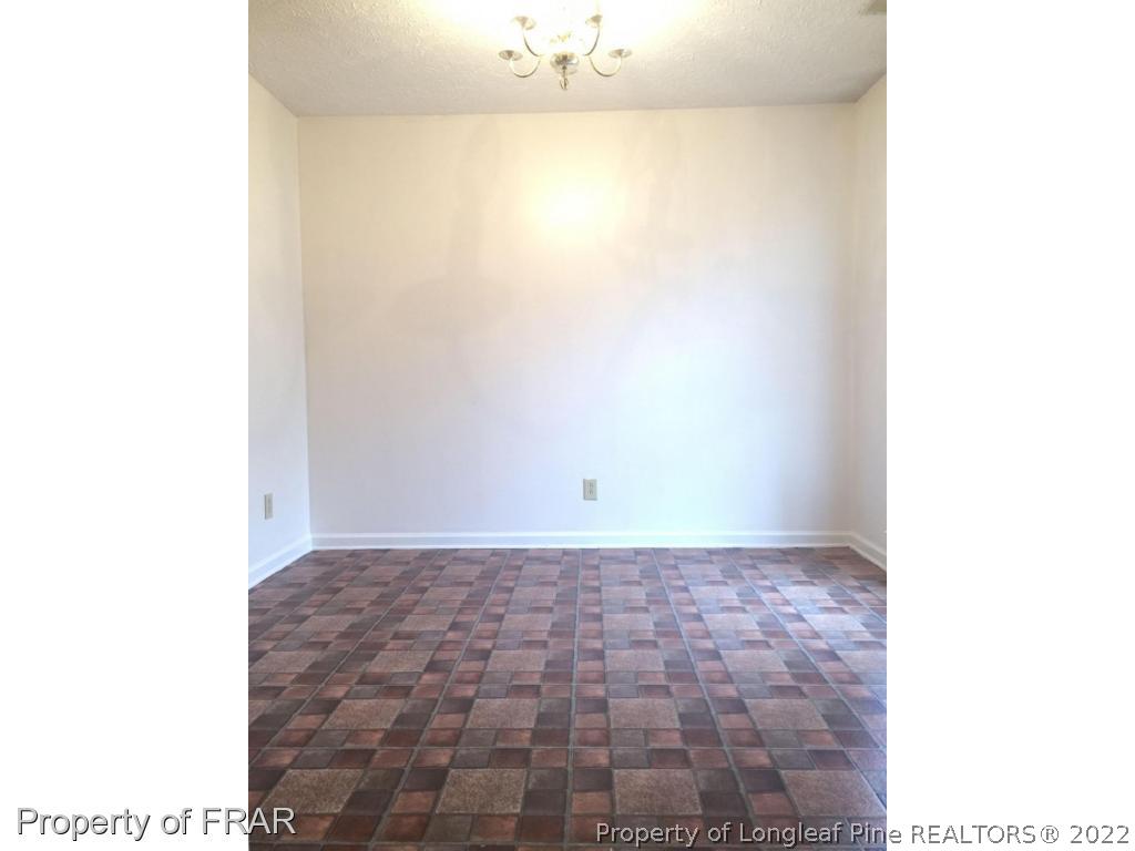 7685 Elliott Bridge Road Spring Lake, NC 28390 - Photo 10 of 26 a view of a big room with a bench