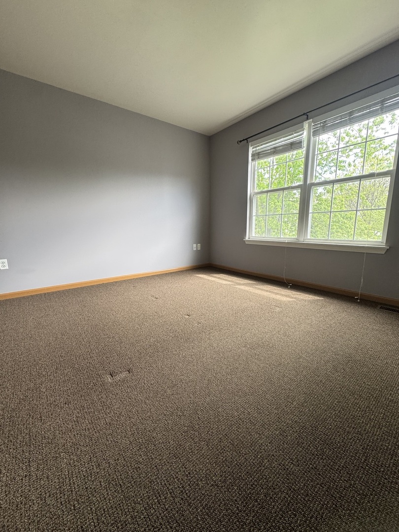1716 William Drive Romeoville, IL 60446 - Photo 15 of 18 an empty room with a window